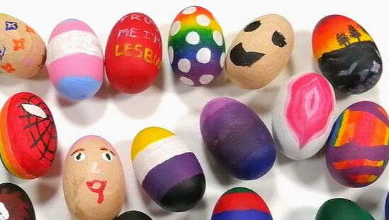 A picture of several painted LGBTQ+ themed wooden eggs, painted by members of OULGBTQ+ Soc at a welfare event.